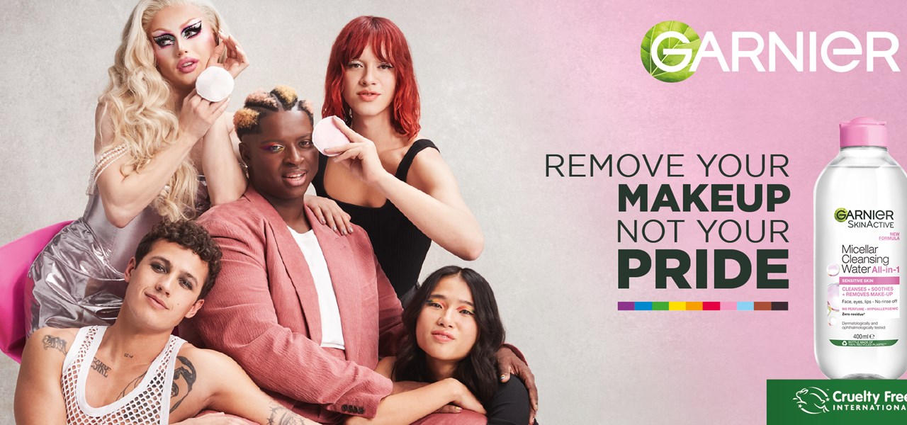 Garnier advertisement showing five glamorously dressed people intertwinded with text - Remove your makeup not your pride