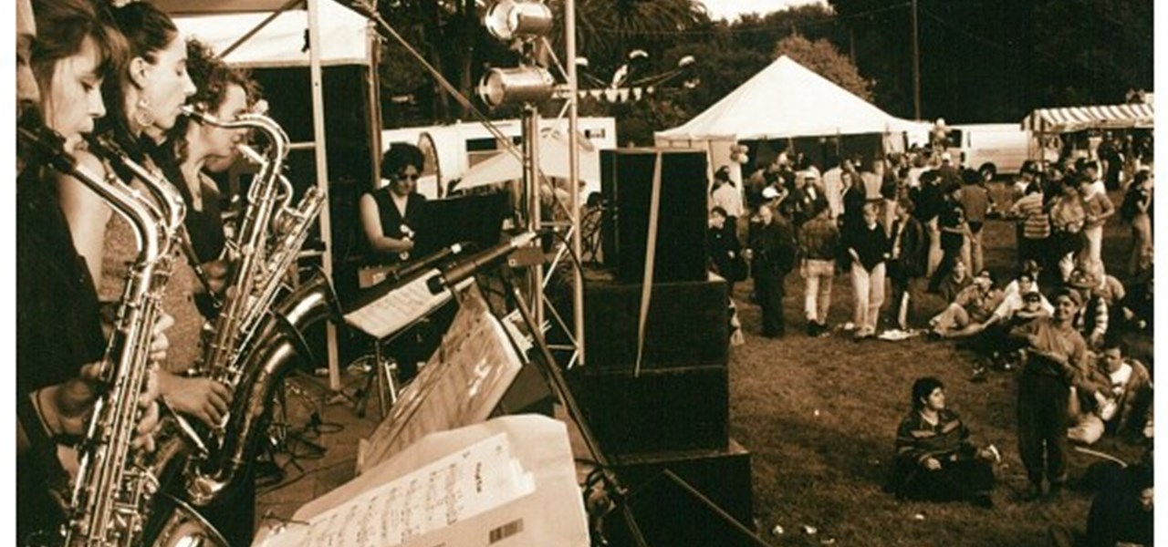 Midsumma Carnival 1996 by Richard Israel and 1997 by Virginia Selleck: small brass band on stage with audience to the right