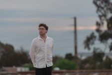 James Rushford outdoors in an urban street setting