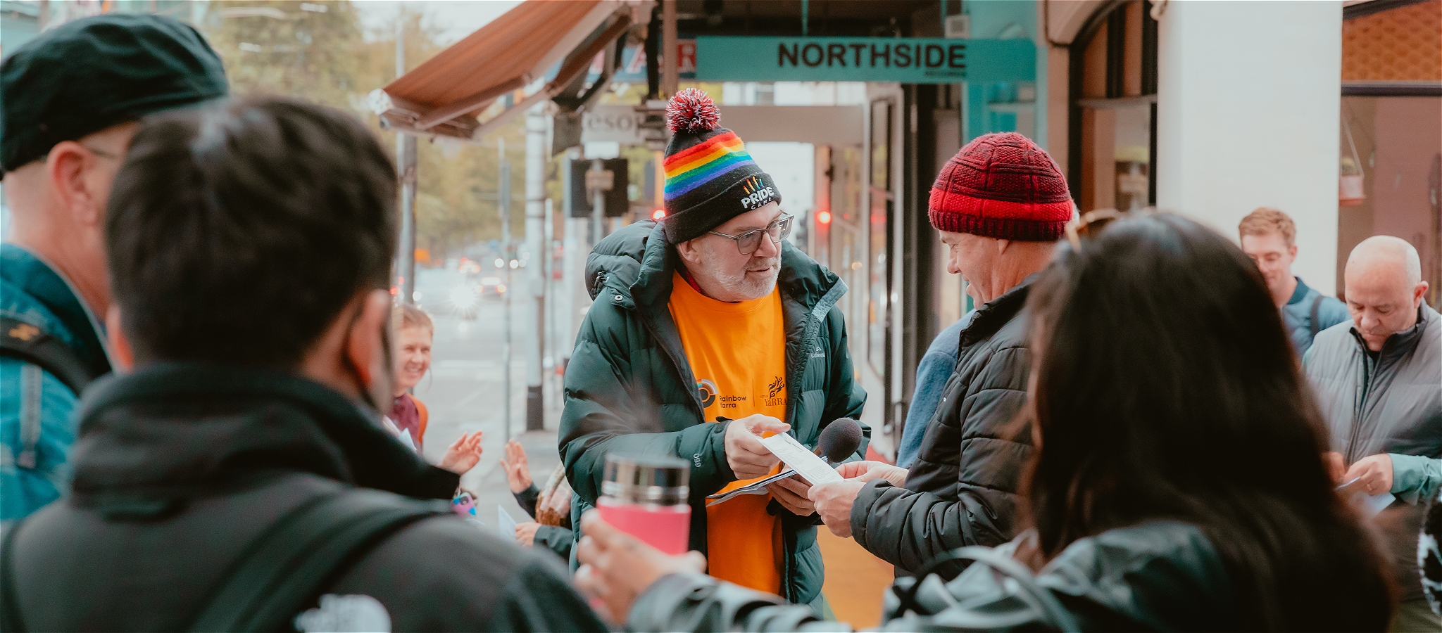 Tour Guide speaks with attendee while standing in a Fitzroy alleyway