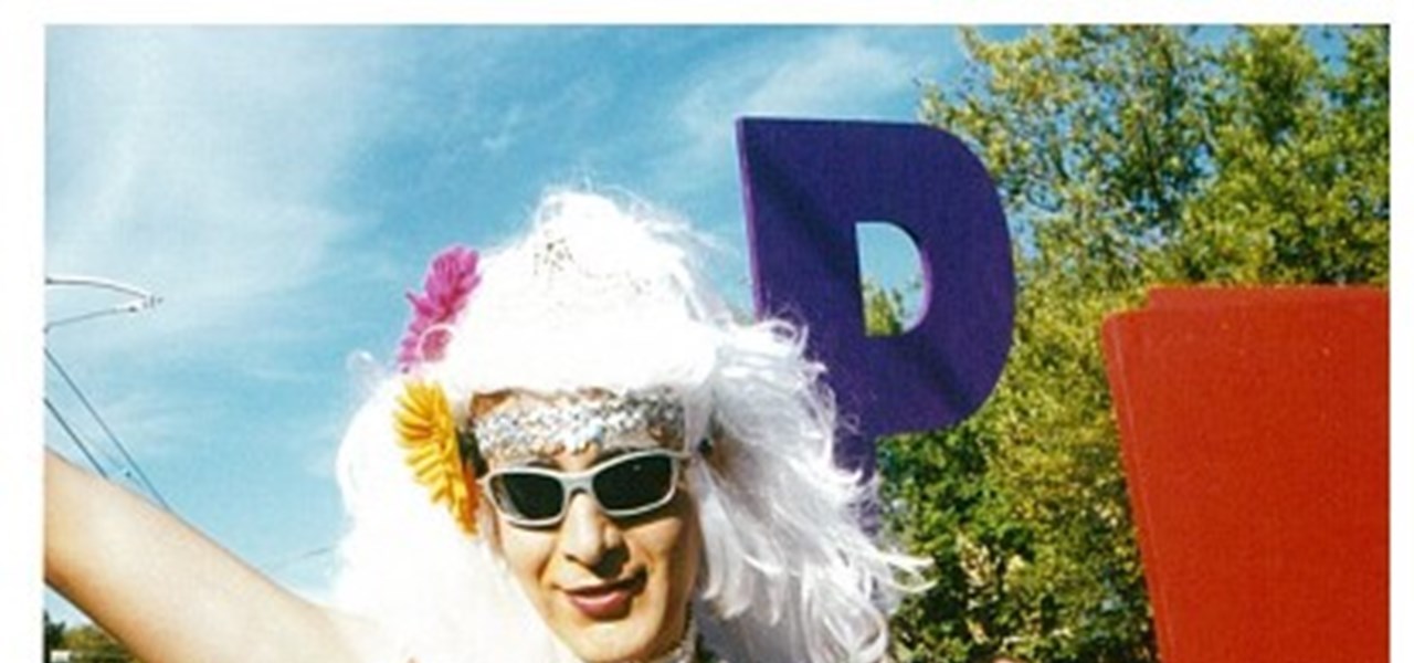 Pride March 2000 image: person holding a large letter "J"