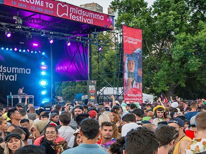 Stage and a dense crowd at Midsumma Carnival