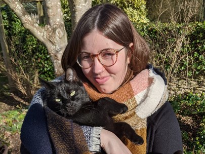 Emily Holland holding a black cat